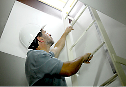 Maine Commercial & Industrial Photography - Inspection Worker on Ladder